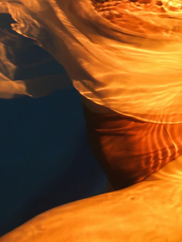 Abstract silhouette of a human body with lines showing energy flow.